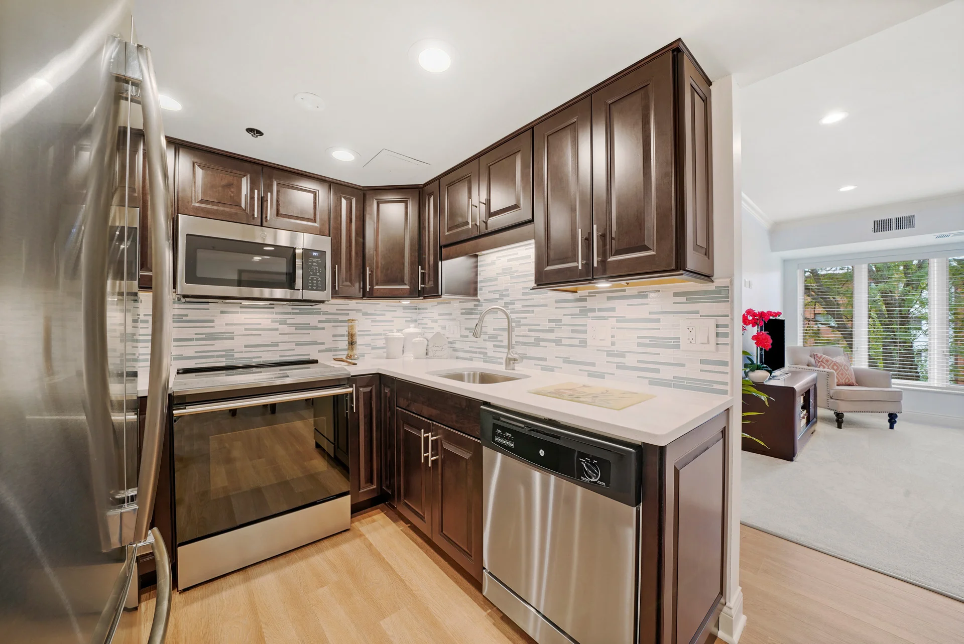 cozy corner kitchen in senior apartment with view of the living room