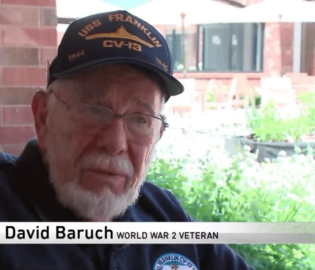 screenshot of news interview with Beacon Hill resident David Baruch telling the story of his WWII service time